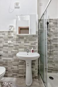a bathroom with a sink and a glass shower at CaTeresa 14 in Venice
