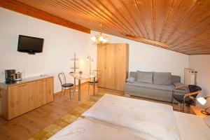 En eller flere senge i et værelse på Bauernhof Daurerhof