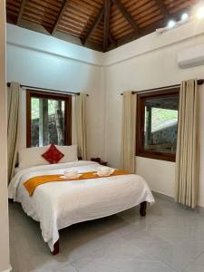 Postel nebo postele na pokoji v ubytování Villa Kep Sea Mountain