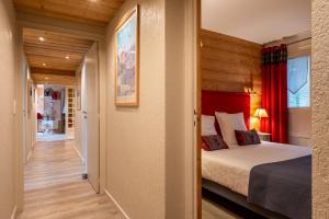 Ένα ή περισσότερα κρεβάτια σε δωμάτιο στο Ourson 3