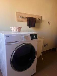 a washing machine with a towel on top of it at Apartment Vesna in Supetarska Draga