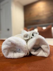a pile of white towels sitting on a table at Chandler Studio Apartments in Evansville +121 photos