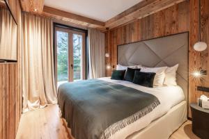 Ένα ή περισσότερα κρεβάτια σε δωμάτιο στο Antarès ORION 001 - luxury apartment ski inski out +11 φωτογραφίες