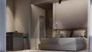 a bedroom with a bed and a table and chairs at M Suites And Hotel in Cochin