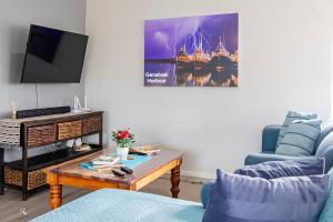 Μια τηλεόραση ή/και κέντρο ψυχαγωγίας στο Southern Whale Self Catering