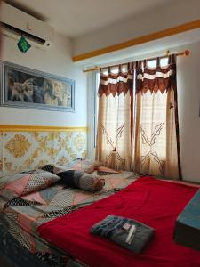 Ένα ή περισσότερα κρεβάτια σε δωμάτιο στο D Rooms Apartemen