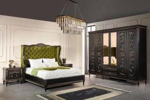 a bedroom with a bed and a chandelier at Grand Lodge E11 in Rawalpindi