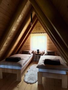 a bedroom with two beds in a attic at Villa Alba in Kupres