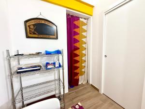 TV a/nebo společenská místnost v ubytování Vicolo Giardi