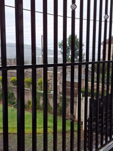 a view through a iron fence of a window at Lakeview Elegance in Nakuru
