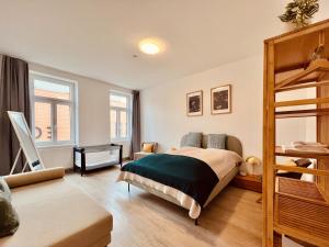 Postel nebo postele na pokoji v ubytování SERVUS HOMES - Metro Stadthalle - SOUND OF MUSIC + 11 fotografií