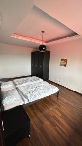 a bedroom with a bed in a room at Dream Apartment in Dąbrowa Górnicza