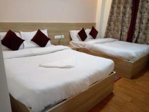 Ένα ή περισσότερα κρεβάτια σε δωμάτιο στο Rising Inn