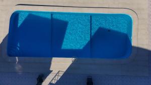 an overhead view of a blue swimming pool at Wayma Paradise Resort in Jambiani