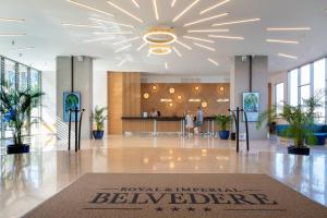 a lobby with a large chandelier in a building at Royal & Imperial Belvedere Resort in Hersonissos