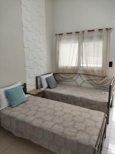 Ένα ή περισσότερα κρεβάτια σε δωμάτιο στο D S Venizelou 88