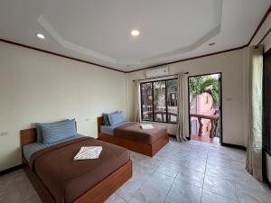 Ένα ή περισσότερα κρεβάτια σε δωμάτιο στο Friendly Resort