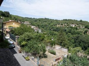 a small village on a hill with trees at Casa Margot by Holiday World in Caprarola
