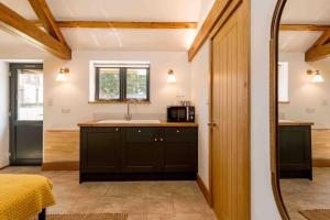 a kitchen with a sink and a counter top at Peaceful Hideaway in South Downs in Angmering