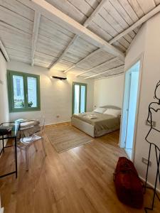a bedroom with a bed and a desk and a table at AbalabÀ - Gallura Retreat - Domo in Aggius