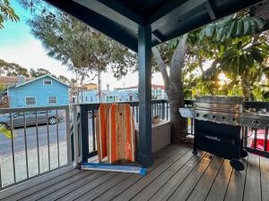 a grill on a deck next to a tree at Urban Zen 2 - Luxury Remodel - Gr8 Deal- WOW in San Diego