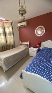 En eller flere senge i et værelse på Lyfrago Departamento Temporario