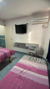 En eller flere senge i et værelse på Lyfrago Departamento Temporario + 1 billede