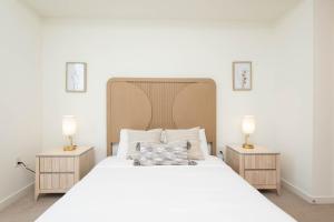 Giường trong phòng chung tại Horizon Apartments