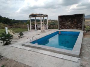 a pool in a backyard with a gazebo and a swimming pool at MM HOUSE Stepanavan in Stepʼanavan +13 photos