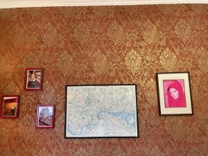a wall with pictures and a map on it at Söruper Hof in Sörup +56 photos