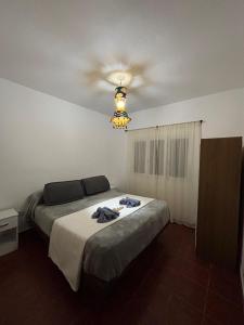 Ένα ή περισσότερα κρεβάτια σε δωμάτιο στο Casa con vista y acceso al río