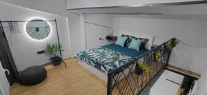 a bedroom with a bed in a room with plants at Nitro Inn 3 Premium - Wine Tasting - Souvenir - Art Gallery - Private Guided Tours - Relaxing - Romantic in Skopje
