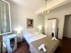 Ένα ή περισσότερα κρεβάτια σε δωμάτιο στο ApartHotel Riviera - BARILLERIE 4 - 3 pieces - Old Town Promenade Anglais