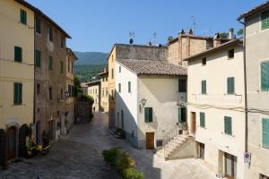 an alley in an old town with buildings at The house of Cetona in piazza Paré in Cetona