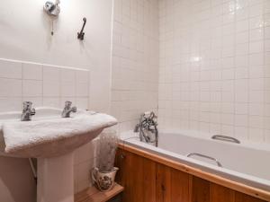 a bathroom with a sink and a bath tub at Wildflower Cottage in Lealholm +27 photos