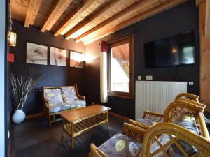 a living room with a couch and a table at Rendeux Retreat with Sauna in La Roche-en-Ardenne +30 photos