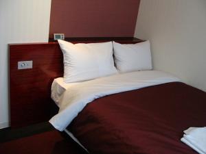 Postel nebo postele na pokoji v ubytování Nesthotel Alt Meguro Ekimae