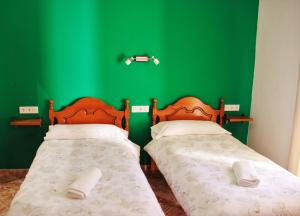 Postel nebo postele na pokoji v ubytování Hostal la zamora