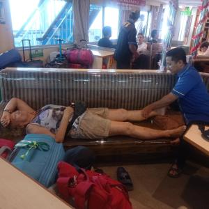 a man and a woman laying on a bench at home SPA BANYUWANGI in Banyuwangi