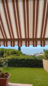 Zahrada ubytování Bilocale vista mare con giardino privato e piscina