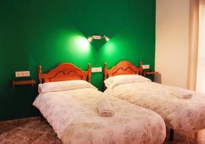 Postel nebo postele na pokoji v ubytování Hostal la zamora