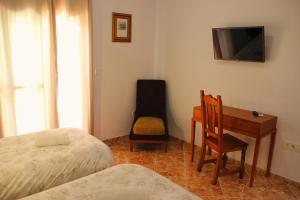 Postel nebo postele na pokoji v ubytování Hostal la zamora