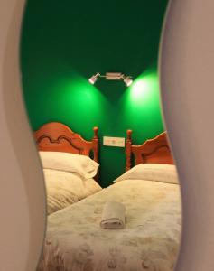 Postel nebo postele na pokoji v ubytování Hostal la zamora