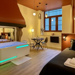 a living room with a tub in the middle of a room at Secret Room in Le Puy en Velay