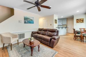 a living room with a couch and a table at Classic Colonial Home with Private Yard in Richmond! in Beulah Village