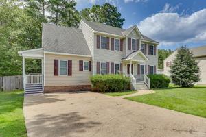 a white house with red shutters at Classic Colonial Home with Private Yard in Richmond! in Beulah Village