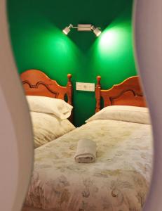 Postel nebo postele na pokoji v ubytování Hostal la zamora