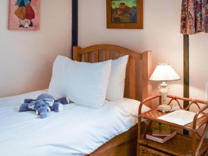 Giường trong phòng chung tại Pelican Cottage +7 ảnh