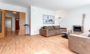 O zonă de relaxare la Fewo Vineta mit zwei Balkonen und Bio-Kamin