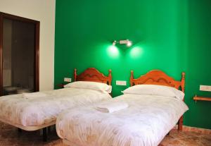 Postel nebo postele na pokoji v ubytování Hostal la zamora